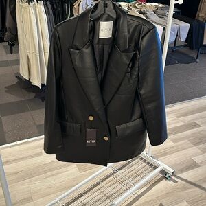 Leather jacket with gold buttons